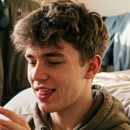 A teenage GameStudy player talking out loud mid-sentence in his bedroom